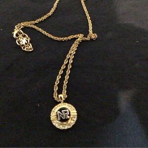 Nina Ricci Signed Gold Plated Necklace with Gold/Silver Logo Pendant/Crystals.